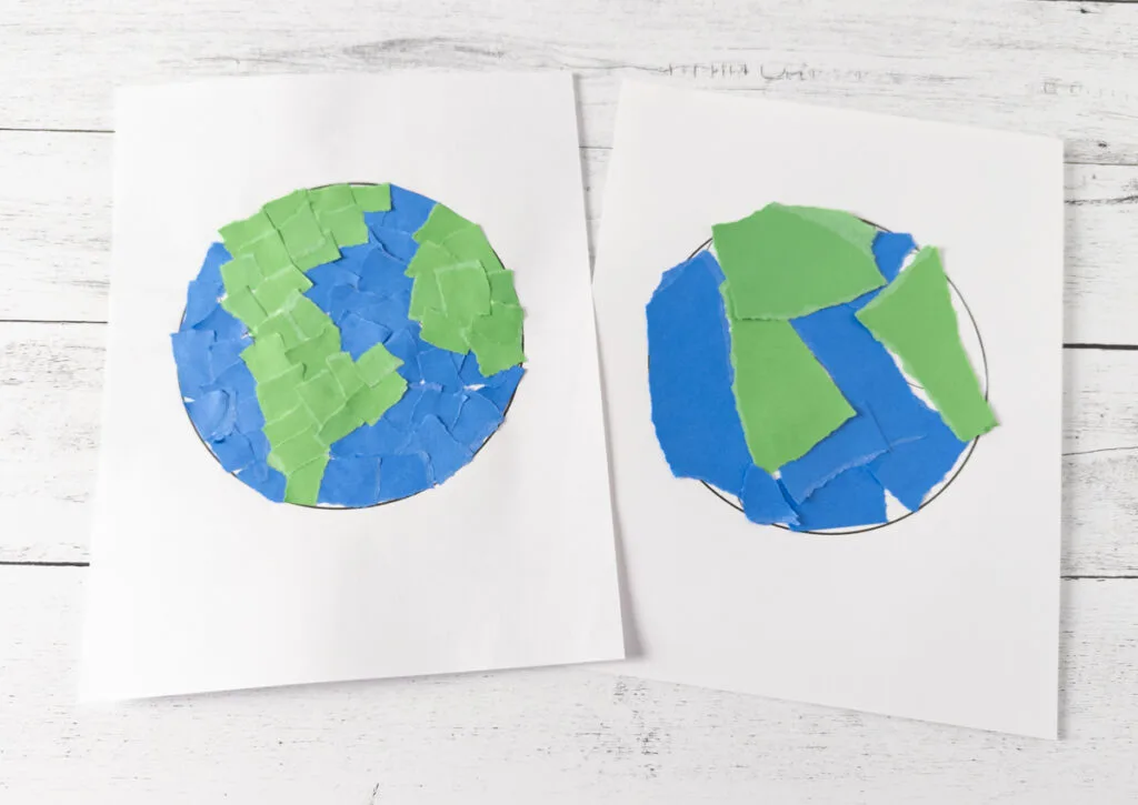 Two finished Earth crafts made with torn paper. One has smaller ripped squares like a mosaic and the other has larger chunks of paper.