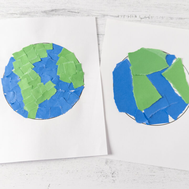 Two finished Earth crafts made with torn paper. One has smaller ripped squares like a mosaic and the other has larger chunks of paper.