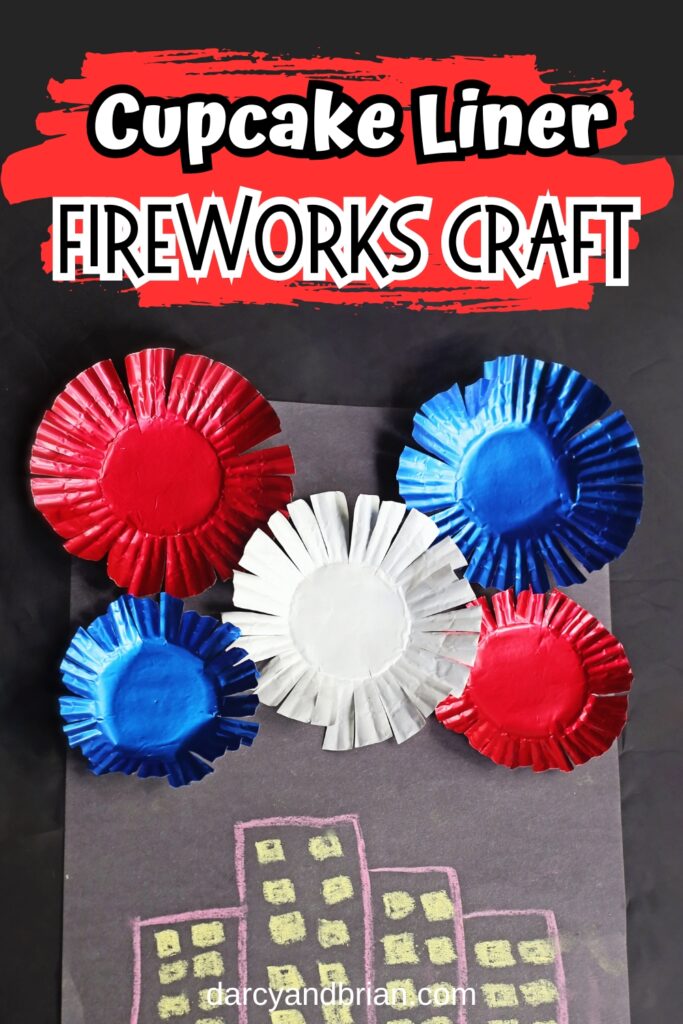 White and black text says Cupcake Liner Fireworks Craft with a red brush stroke behind it. Below is a photo of a craft project with buildings drawn on black paper and assorted red, white, and blue baking cups glued to it.