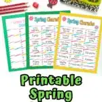 Preview of Spring themed charades printable prompts laying on colored papers. Top is decorated with ladybug and flower erasers and crayons.