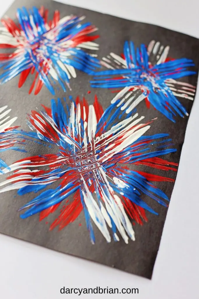 Showing the streaks and texture of fork tines in the red, white, and blue paint.