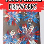 Completed painting of fireworks using a fork on construction paper.