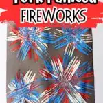 Completed painting of fireworks using a fork on construction paper.