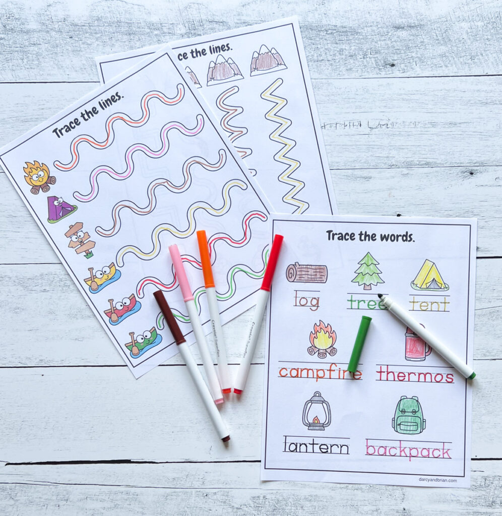 Handwriting practice with camping objects and pictures colored in.