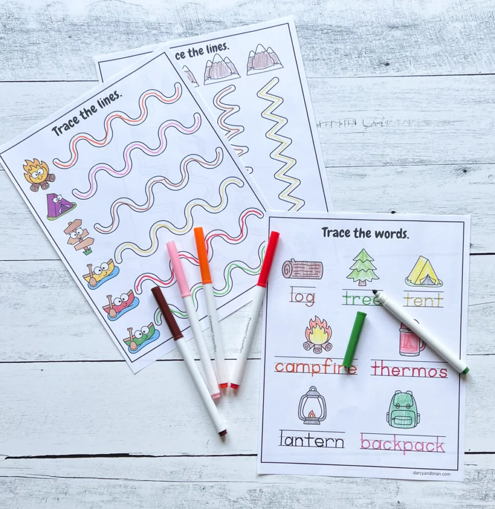 Handwriting practice with camping objects and pictures colored in.