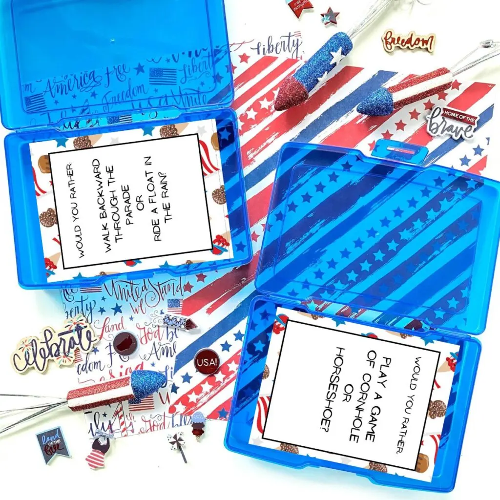 Blue task boxes with 4th of July would you rather? cards inside. Table is decorated with red, white, and blue mini rockets, pins, and paper.