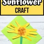 Black and white text on yellow background at the top says Handprint Sunflower Craft. A sunflower made using construction paper and tracing hands for petals laying on bright green paper.